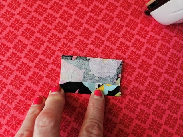 Open the strap up and fold to center