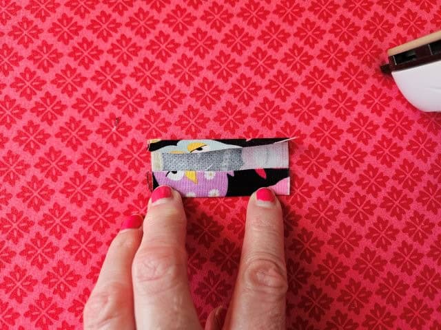 Turn the strap around and fold other side to center