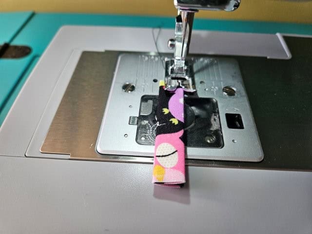 Sew the strap along the folds