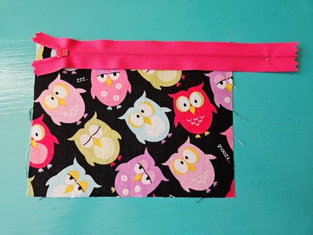 Place zipper on outer fabric piece