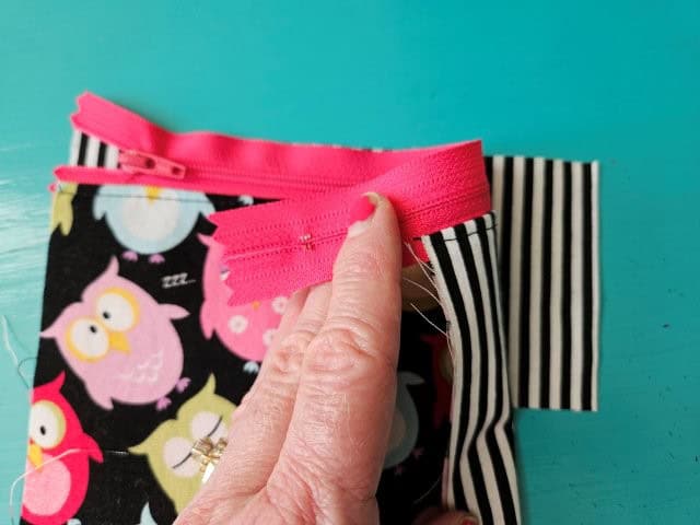 Other side of zipper on lining fabric piece