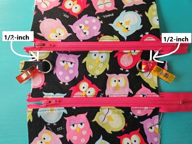 Place shorts straps 1/2- down from the zipper