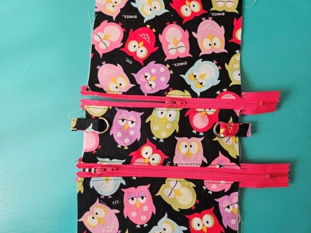 Open the zipper halfway