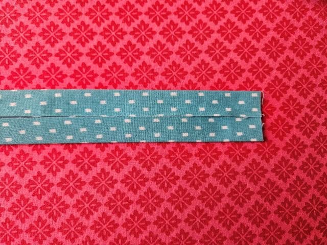 Fold each long side to center