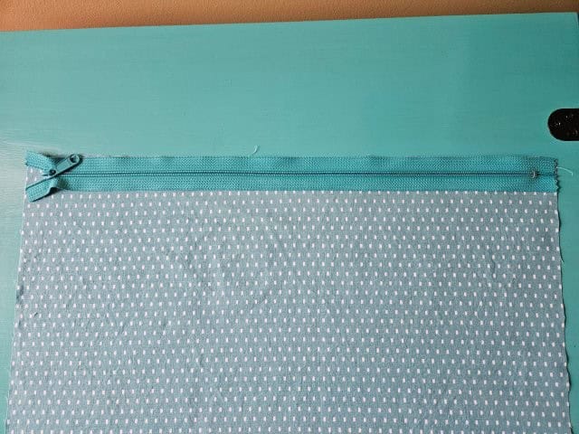 Place zipper on top of lining fabric