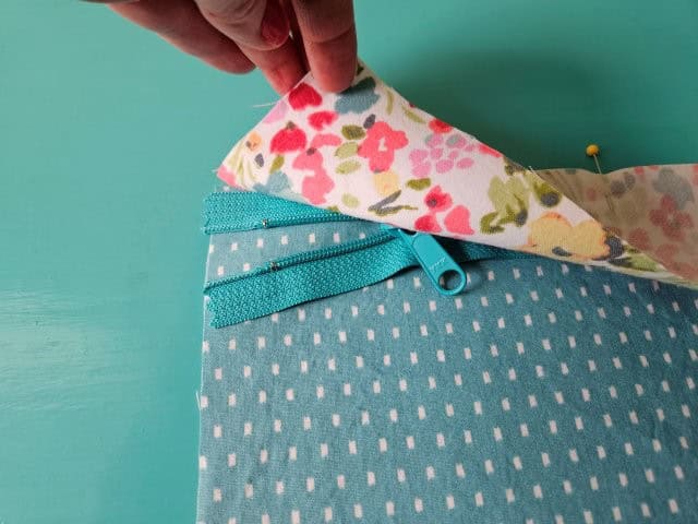 Open the zipper about one inch before sewing