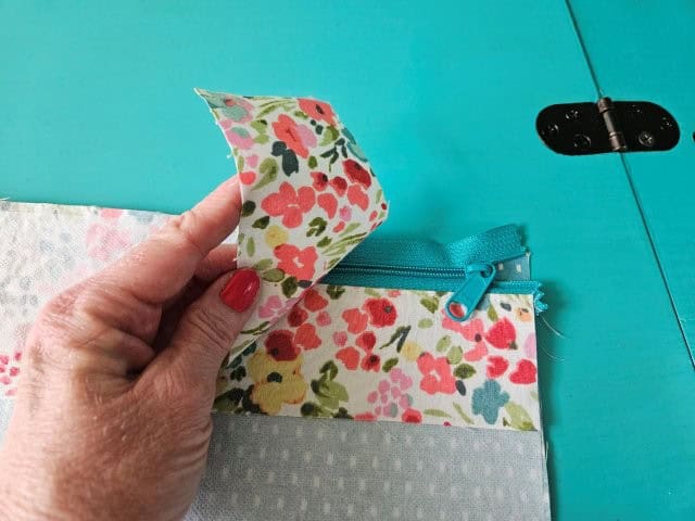 Place the other recessed zipper fabric piece on top of zipper