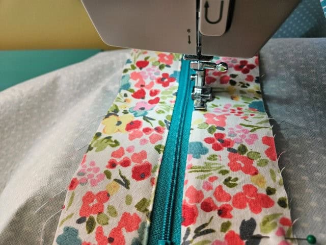 Top stitch along the zipper