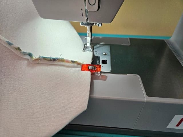 Sew along the edge of the bottom square