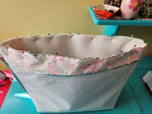 Line up the seams and pin all around the top of the bag.