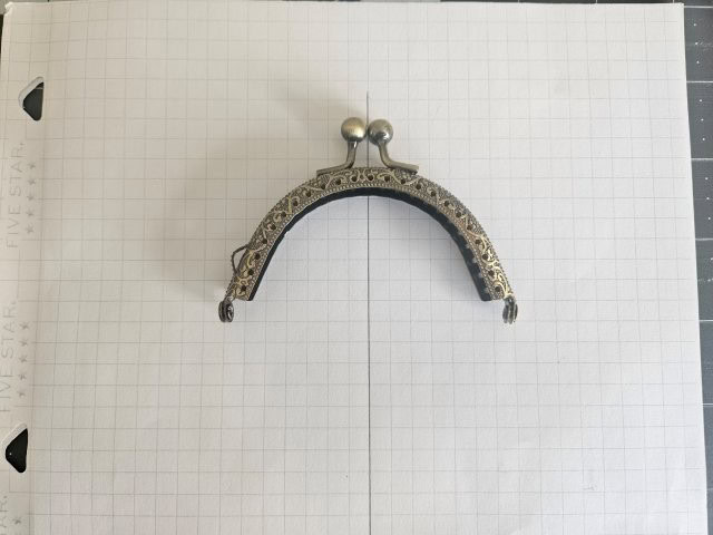 Place metal frame on graph paper centered on the line