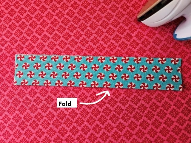 Fold the strap in half lengthwise