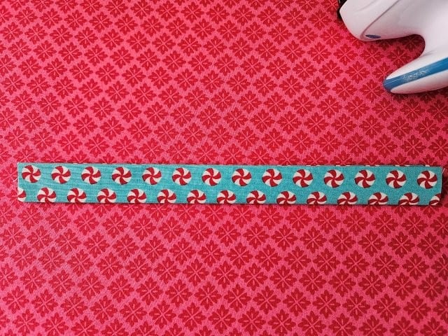 Fold the strap in half again