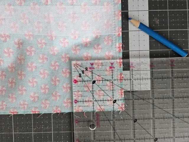 Mark 2.5" squares at each bottom corner