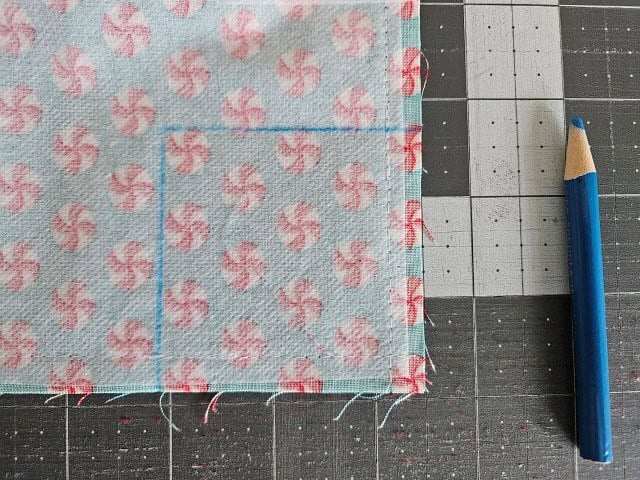 Picture of the marked lines to square the bottom of the small tote bag