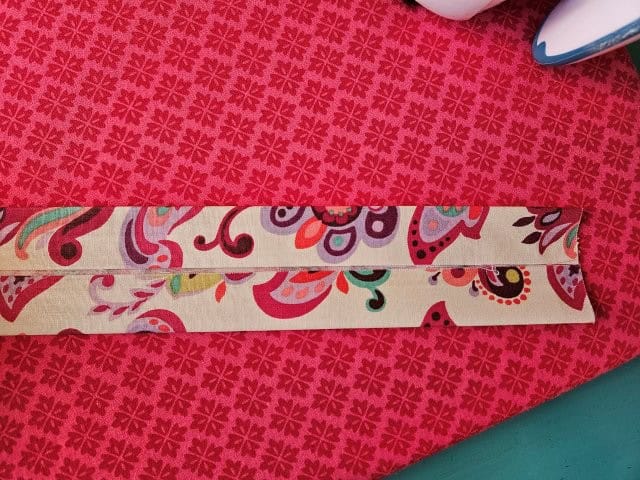 Fold other side to center