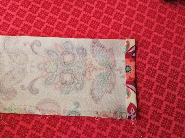 Hem the short ends of the long strap