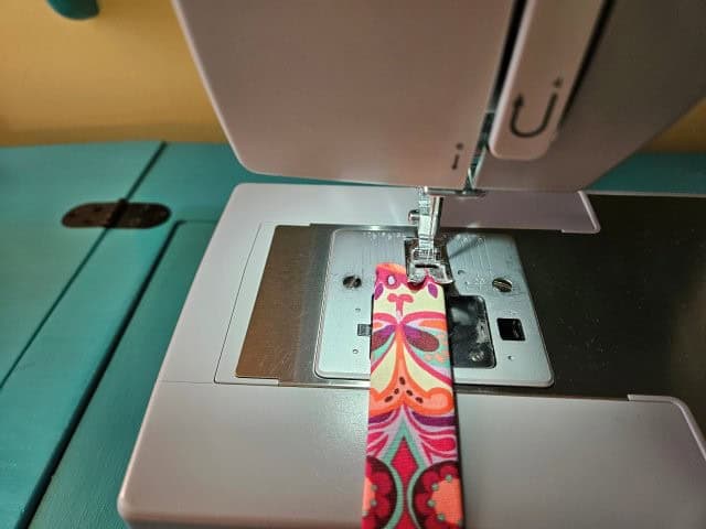 Sew the strap along the folded edges