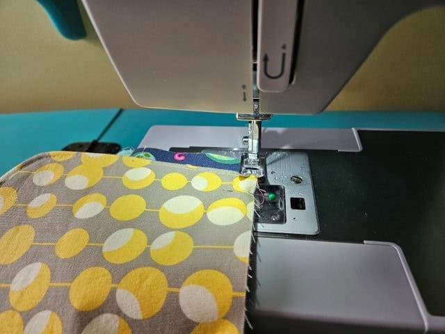 Baste the flap cover to the patchwork messenger bag