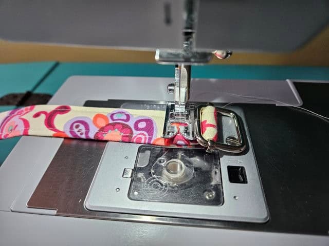 Sew the strap to attach the slide