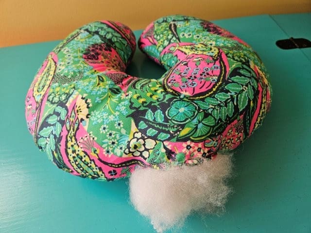 Stuff the neck pillow with fiber fill stuffing
