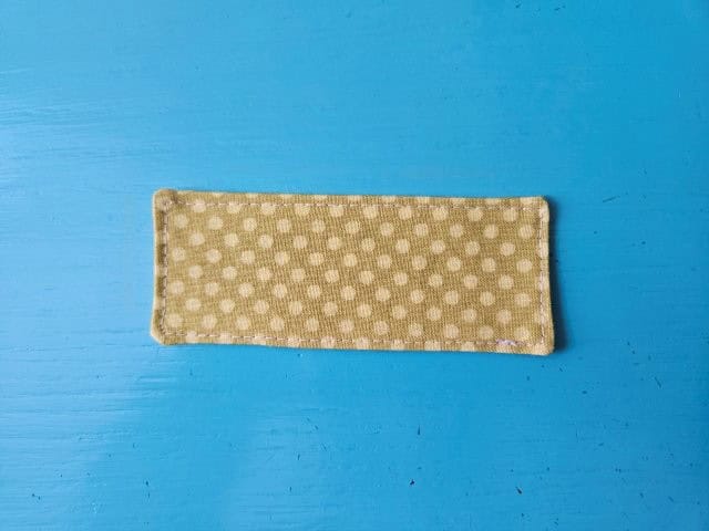 Top stitch around the cord strap