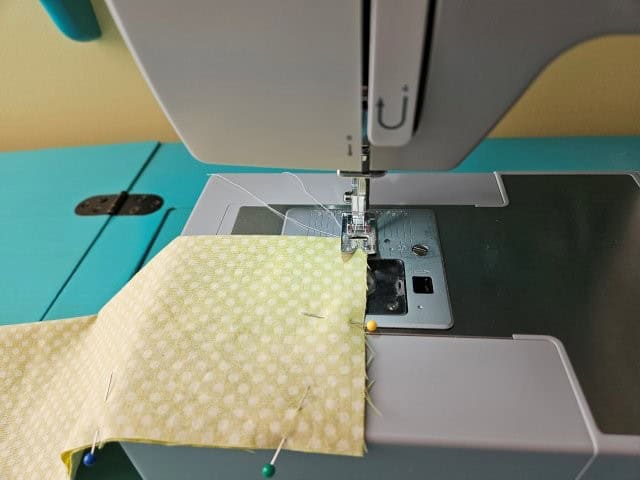 Sew together the three raw edges of the travel case