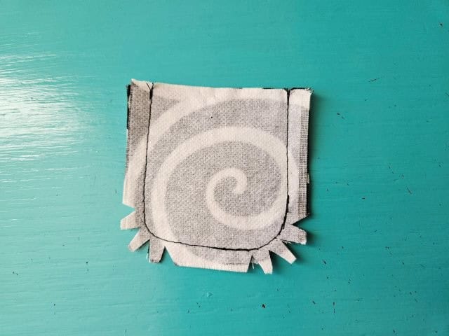 Cut little triangles around the curves