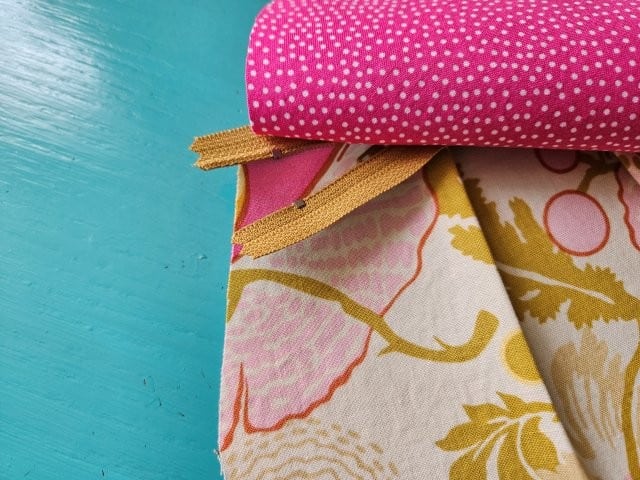 Open zipper pull before sewing