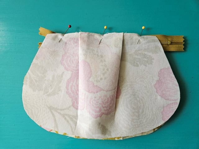 Outer fabric on top of zipper