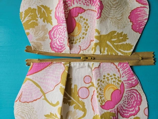 Open the zipper to about halfway