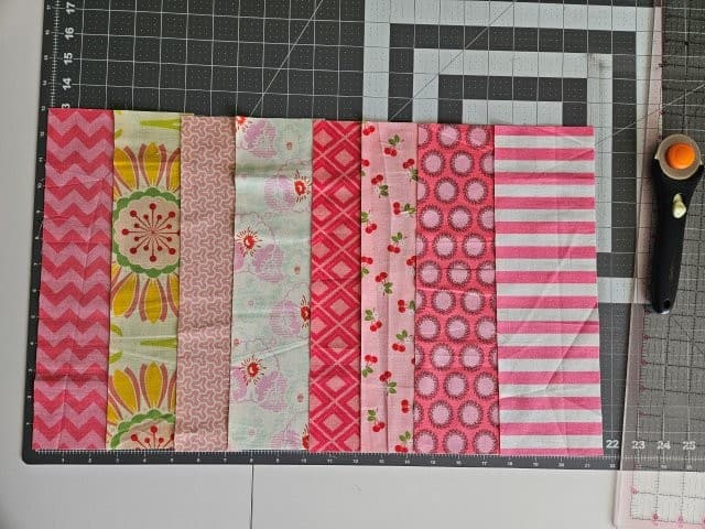 Strips of fabric scraps for the pillow cover pattern