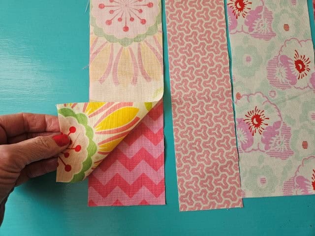 First and second fabric strips right sides together