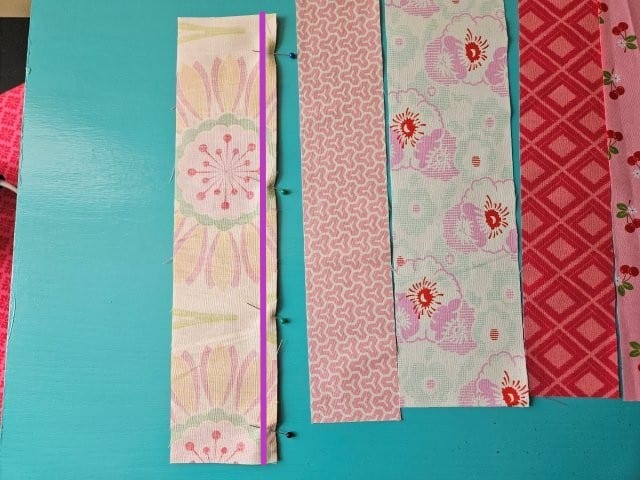 Sew down the right hand side of the fabric strips