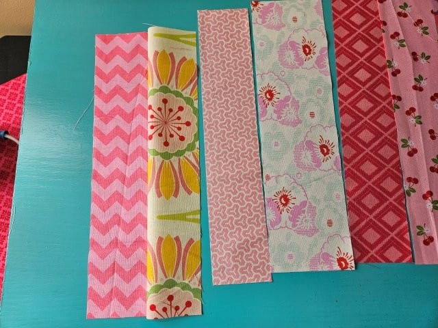 Picture of the first two fabric scraps sewing together