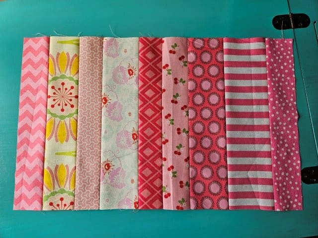 All the fabric scraps for the front of the pillow cover pattern sewn together