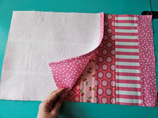 Place one of the back fabric pieces on top of the front piece, right sides together