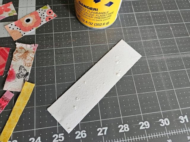 Spray the basting adhesive onto the cardstock