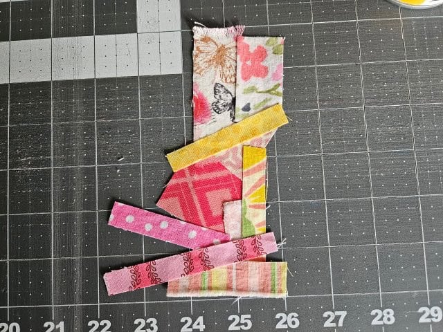 All the fabric scraps on the bookmark