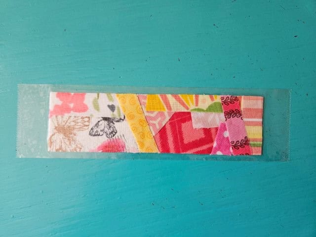 Place the back of the bookmark onto the tape