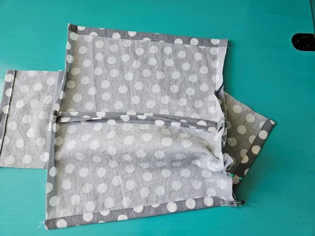 Place the raw edges together and pin