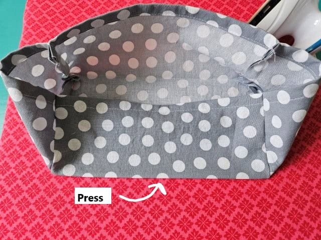 Press the top of the tissue box cover