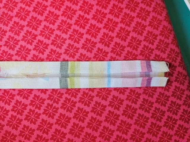Fold the other side of the strap to center