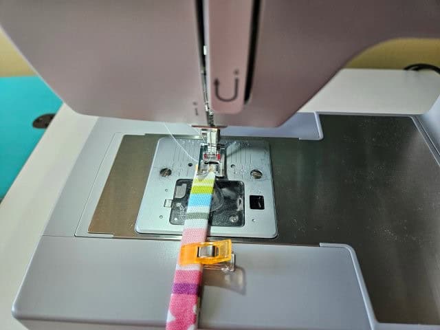 Sew along each edge of the strap lengthwise