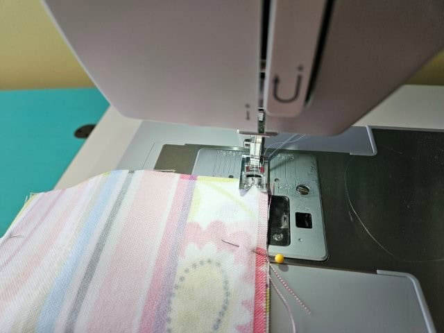 Sew along the top and bottom of the pocket fabric pieces