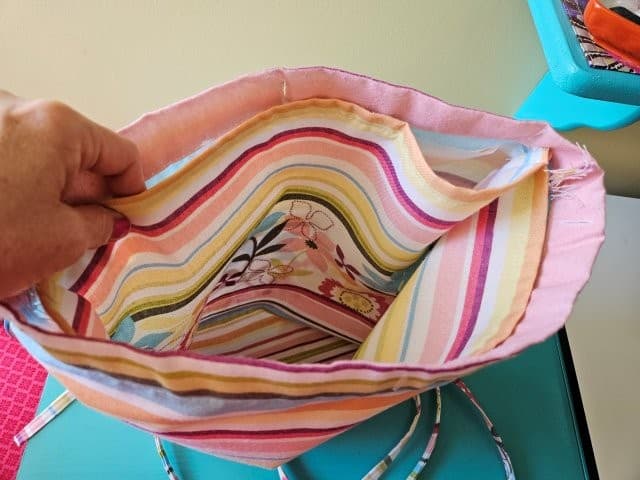 Place lining bag inside outer bag, wrong sides together