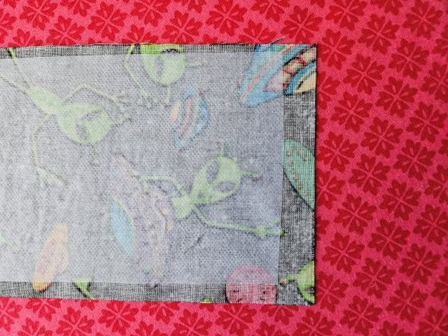 Interfacing 1/2-inch from end of the long strap on each end