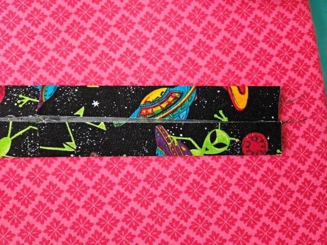 Fold the other side of the strap to the center