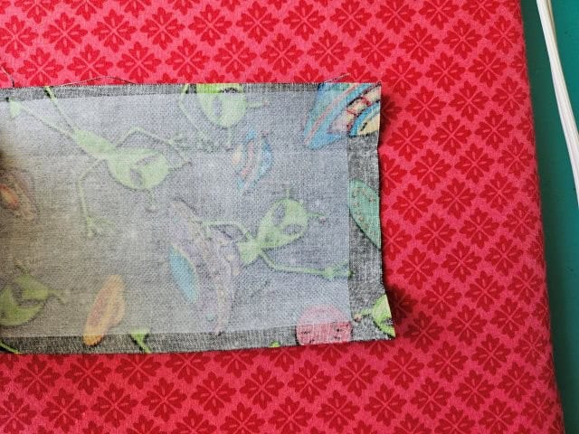 Fold over the end of the strap and press