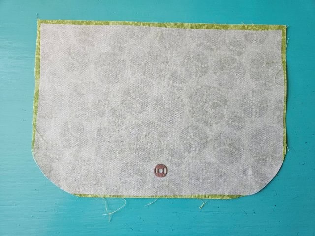 Place the washer where the snap will be on the flap cover
